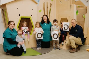 Canopy Nursery in Shrewsbury has been award a 'Good' Ofsted rating. Pictured are Lucy Barnes, Rachel Moelwyn-Williams and Dan Moelwyn-Williams with some of the children