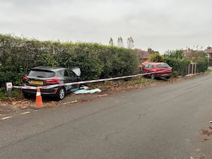 Two cars inside the fence after Wellington crash