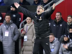 Southampton manager Ivan Juric raises both arms on the touchline