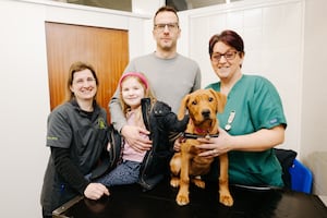 Veterinary Surgeon Beverly Mills with 6 year old Erin Walker, James Walker, Ember the Labrador and RVN and manager Julieann Berry