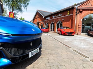 A blue car at a Ferrari dealership, Hampshire