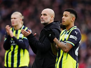 Guardiola claps the away support at Villa Park