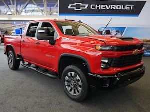 A 2024 Chevolet Silverado 2500 HD Custom truck on display at the Pittsburgh International Auto Show