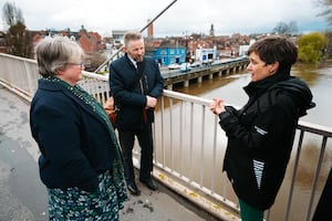 Mark Barrow, centre, discussing the River Severn with former Environment Minister Therese Coffey, and Clare Dinnis from the Environment Agency.