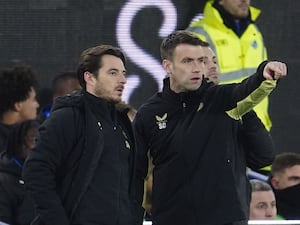 Leighton Baines (left) and Seamus Coleman on the touchline