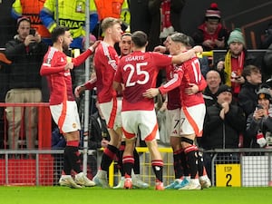 Alejandro Garnacho celebrates scoring Manchester United's opening goal with team-mates.