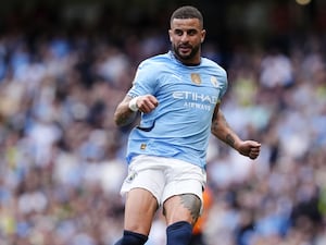 Kyle Walker passes the ball during a Manchester City game