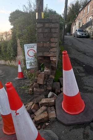 Pic in Ironbridge, Church Hill at the junction with New Road, where a vehicle has damaged an old historic wall.