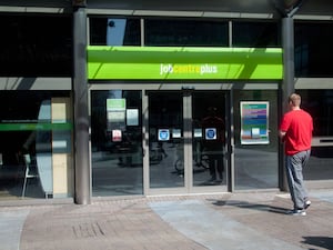 Jobcentre Plus entrance with a person walking towards the doors