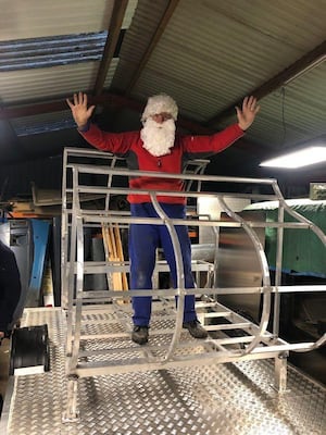 Santa tries out the new Rotary sleigh whilst it is still in the workshop.