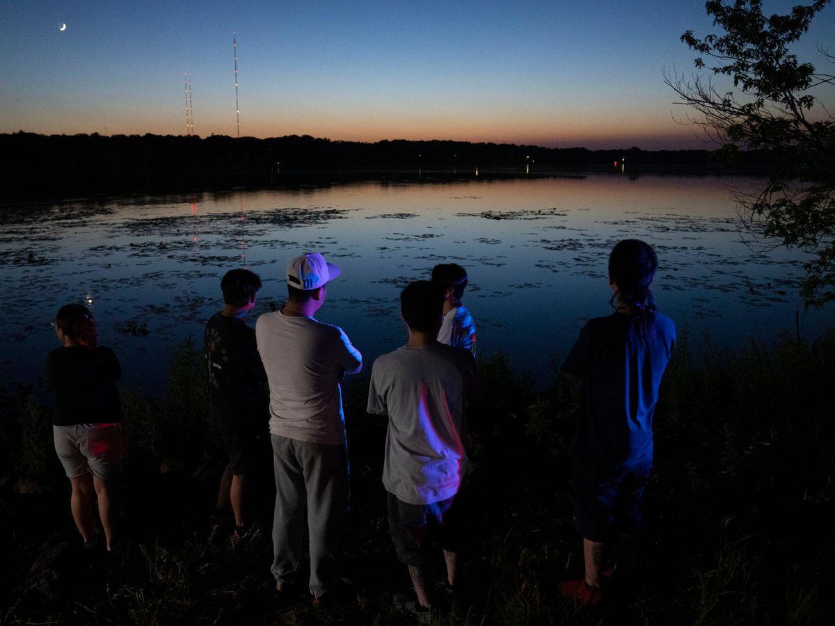 Friends and family gather at Wadnes Lake after news of a dead child being pulled from the lake